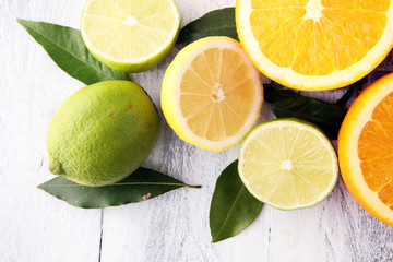Citrus background. Assorted fresh citrus fruit. Lemon, orange lime, grapefruit. Fresh and colorful concept.