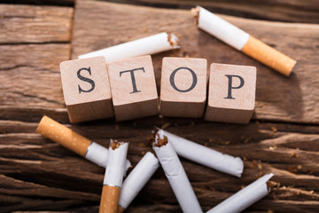 Cigarette And Wooden Blocks Showing Stop Word