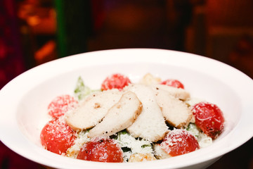 salad with crackers and cherry tomatoes