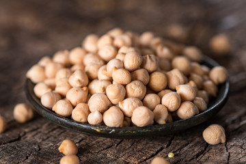 Organic chickpea on wooden  background