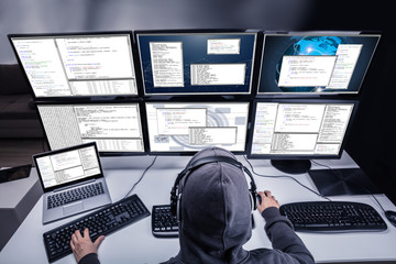 Hacker Stealing Information From Multiple Computers
