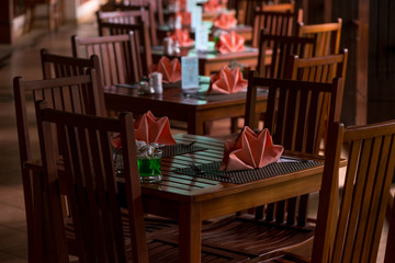 wooden furniture tables and chairs in the cafe on the veranda there are no people
