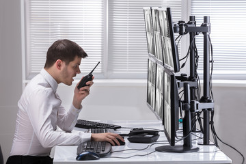 Security Guard Monitoring CCTV Footage
