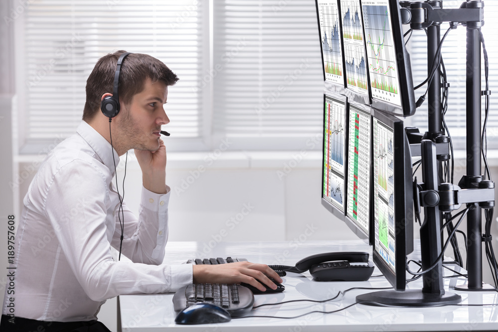 Poster stock market broker analyzing graphs on computer screens