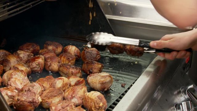 Delicious chicken and bacon balls cooking on BBQ