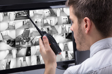 Security Guard Monitoring CCTV Footage