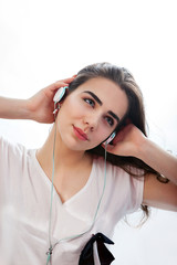 Young girl is listening to music