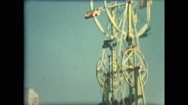 1960s era home movie clip of amusement ride