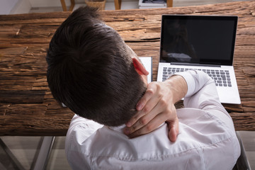 Businessman Suffering From Neck Ache