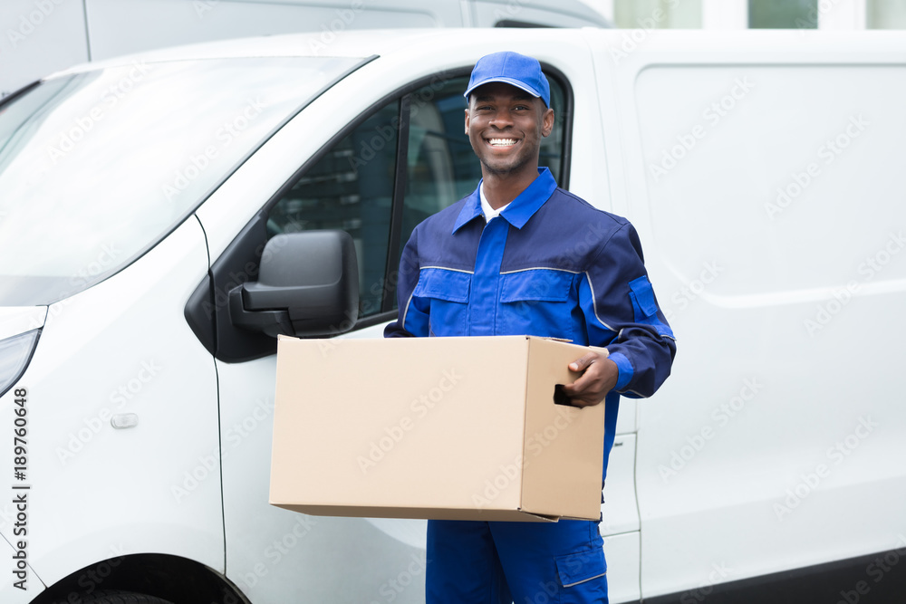 Wall mural delivery man with cardboard box