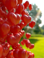 red hearts balloons over blue sky. Love, valentines day, romantic, wadding or birthday background