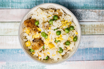 Homemade Chinese fried rice with vegetables and fried eggs