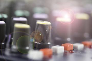 Sound engineer, controls to adjust the music equalizer, DJ equipment.