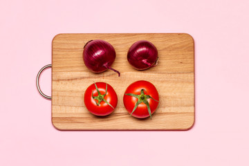 Healthy Eating. Two Fresh Violet Bulbs Near Two Tomatoes On A Wooden Chopping Board