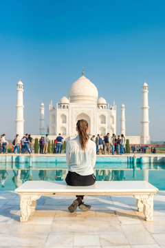 girl sitting on bench in front of Taj Mahal, Agra, Uttar Pradesh