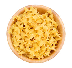  Yellow pasta in wooden bowl on white