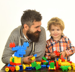 Father and kid in playroom. Family with smiling faces