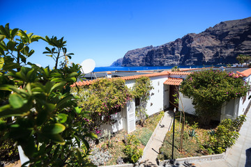 residential apartments with sea port of Los Gigantes in the background