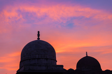 Mandu India, afghan ruins of islam kingdom, mosque monument and muslim tomb. Colorful sky at...