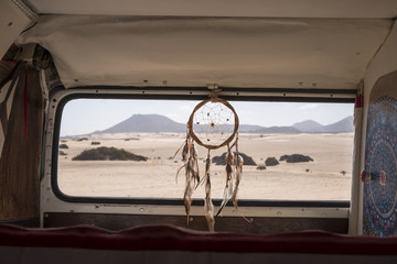 tiny house on wheels with dreamcather near the back window