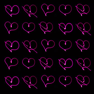 simple seamless background of neon hearts on a dark background