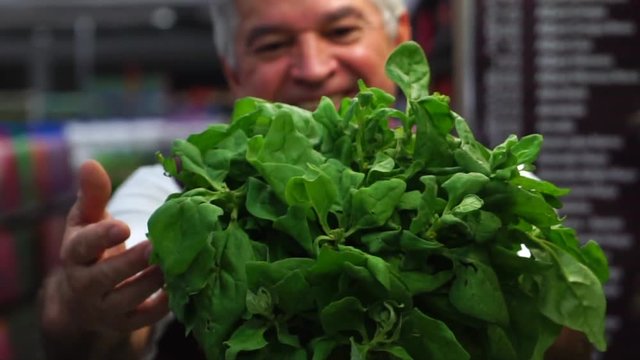 Mature Man Showing Spinach