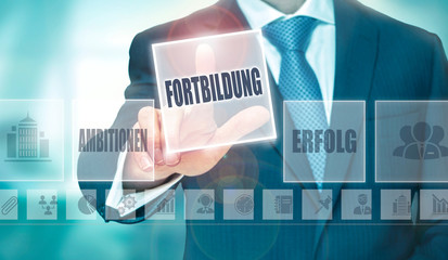 A businessman pressing a Further Education 