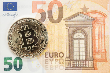 golden bitcoin and 50 Euro bill