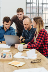Manager having a meeting with his young team