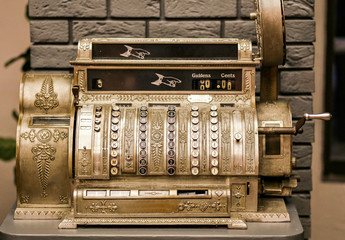 Antiques, an old cash register. Close - up