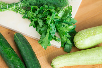 Fresh green vegetables on a kitchen table