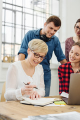 Fototapeta premium Smiling group of young business co-workers