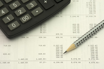 Accounting concept. Pencil and calculator on a numbers background