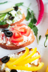 Bruschetta bread with basil and chopped tomatoes.