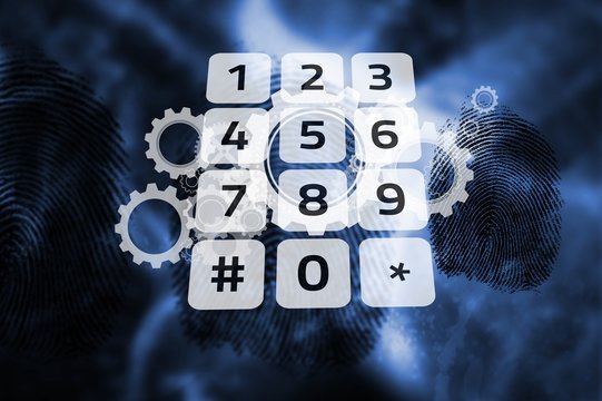 Keypad on digital cog and wheel background