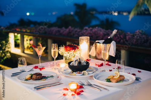 Romantic candlelight dinner table setup for Valentine\'s day with ... Romantic candlelight dinner table setup for Valentine\'s day with ...