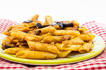 Spaghetti with aubergine and tomato sauce on a the table