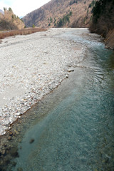 Small river  that crosses a mountainous zone