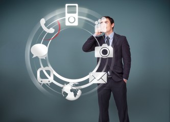 Businessman on the phone looking at wheel of applications