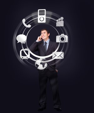 Businessman on the phone looking at wheel of applications light