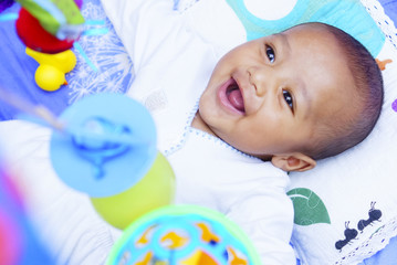 Happy Baby Boy Playing With Baby Play Gym