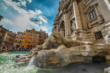 Fototapeta na wymiar Tourists by world famous Fontana di Trevi