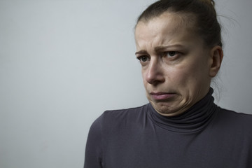 Fototapeta premium A woman expresses an emotion of disgust.