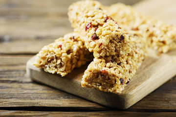 Energy bars with dryed fruits on the wooden table