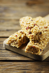 Energy bars with dryed fruits on the wooden table