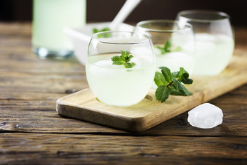 Summer cocktail with rum, ice and mint
