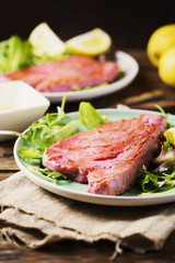 Cooked delicious tuna fish with green salad