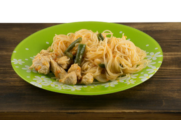 Asian noodles with green beans and turkey. Pad Thai with turkey. Rice noodles.