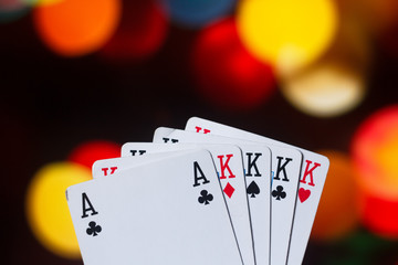 Four of a kind poker cards combination on blurred background casino luck fortune card game