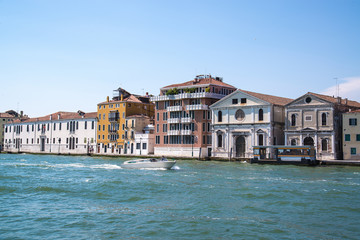 Obraz premium View of the beautiful architecture and boat along canals in Venice, Italy
